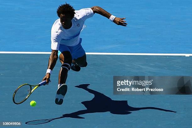 Gael Monfils of France plays a forehand during his match against Lleyton Hewitt of Australia during day four of the AAMI Classic at Kooyong on...