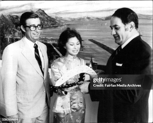 Mr. Keith Sillett, the General Marketing manager of Cathay Pacific Airways, presenting a bridge carved from ivory, to the Lord Mayor of Sydney, Ald....