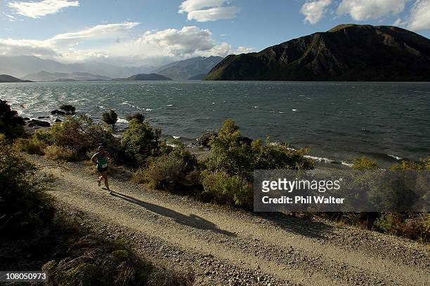Compeditor runs around Lake Wanaka during the Challenge Wanaka on January 15, 2011 in Wanaka, New Zealand.
