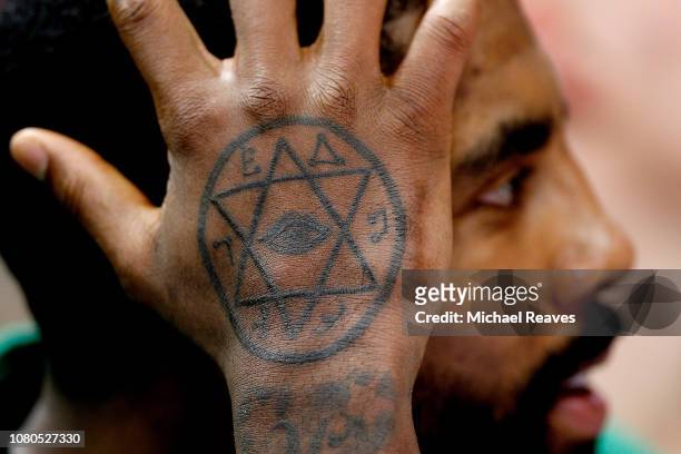 Detail of Kyrie Irving of the Boston Celtics tatto against the Miami Heat during the second half at American Airlines Arena on January 10, 2019 in...