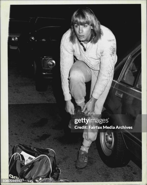 Warwick,Swans star Warwick Capper pulls up his socks and pulls on his boots outside Ashfield council's works depot today.last week a council...