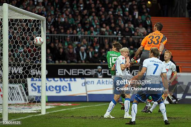 Sebastian Proedl of Bremen heads the ball on the crossbar against Andreas Beck and Tom Starke during the Bundesliga match between SV Werder Bremen...