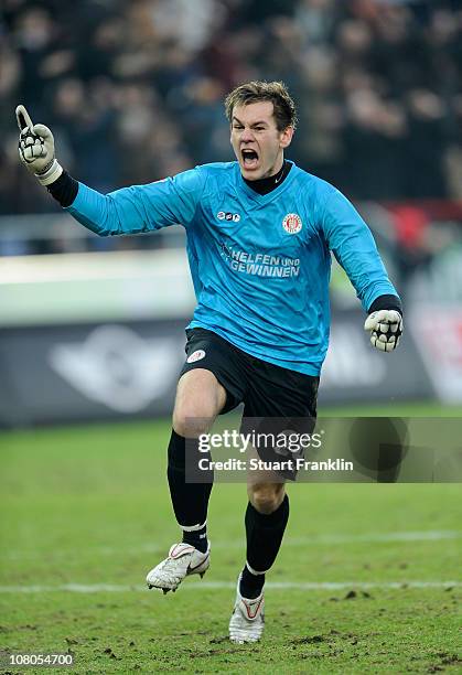 Goalkeeper Thomas Kessler of St. Pauli celebrates his teams goal during the Bundesliga match between FC St. Pauli and SC Freiburg at Millerntor...