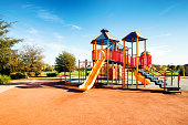 New Public Suburban Children park playground in California with slides on a sunny day