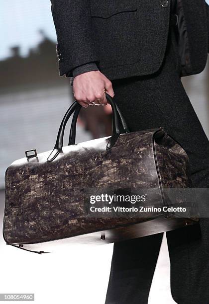 Model walks down the runway during the Ermenegildo Zegna Milan Fashion Week Menswear A/W 2011 show on January 15, 2011 in Milan, Italy.