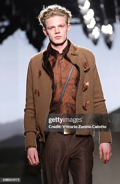 Model walks down the runway during the Ermenegildo Zegna Milan Fashion Week Menswear A/W 2011 show on January 15, 2011 in Milan, Italy.