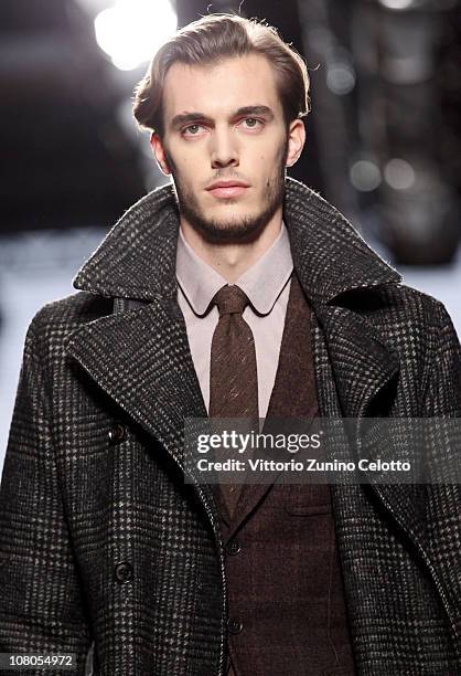 Model walks down the runway during the Ermenegildo Zegna Milan Fashion Week Menswear A/W 2011 show on January 15, 2011 in Milan, Italy.