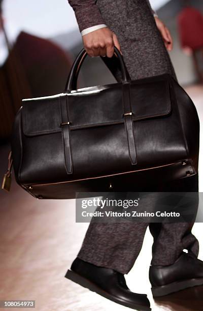 Model walks down the runway during the Ermenegildo Zegna Milan Fashion Week Menswear A/W 2011 show on January 15, 2011 in Milan, Italy.