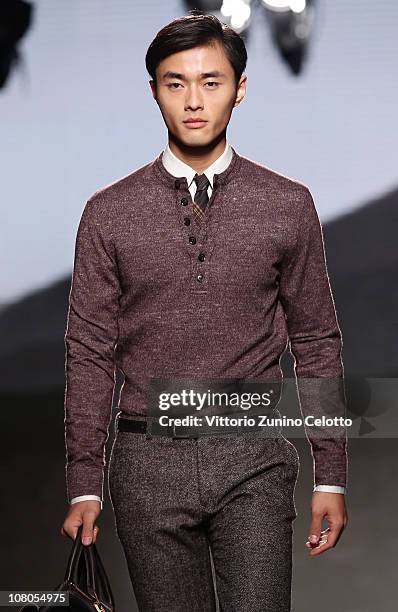 Model walks down the runway during the Ermenegildo Zegna Milan Fashion Week Menswear A/W 2011 show on January 15, 2011 in Milan, Italy.