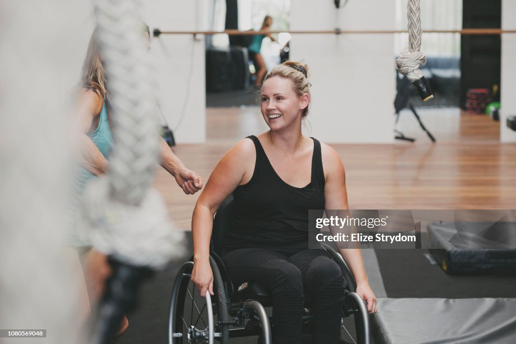 Paraplegic woman in a gym