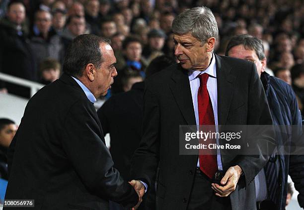 Avram Grant , manager of West Ham United shakes hands with Arsene Wenger, Manager of Arsenal ahead of the Barclays Premier League match between West...