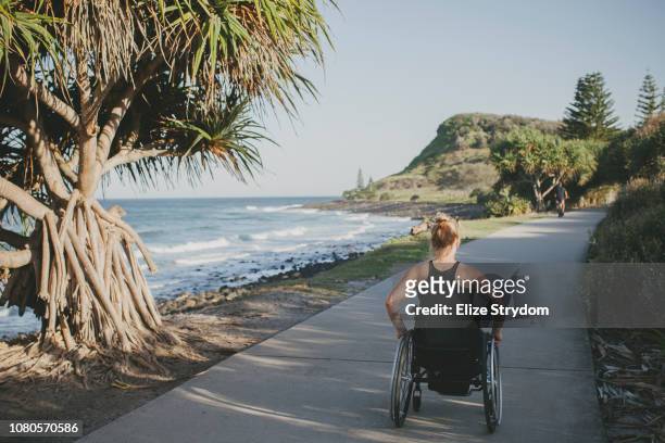 Paraplegic woman by the ocean