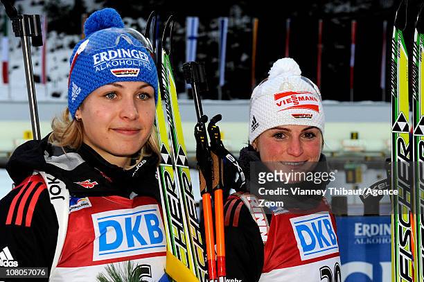 Andrea Henkel of Germany takes 2nd place, Magdalena Neuner of Germany takes 3rd place during the IBU World Cup Biathlon Women's 7.5 km Sprint on...