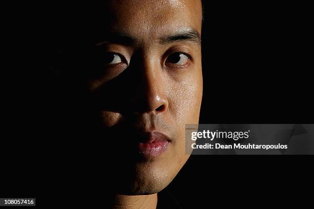 Marco Fu of Hong Kong poses for a photo after his victory against Mark Allen of Northern Ireland in the semi final of The Ladbrokesmobile Masters on...