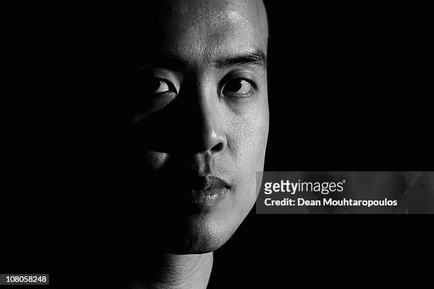 Marco Fu of Hong Kong poses for a photo after his victory against Mark Allen of Northern Ireland in the semi final of The Ladbrokesmobile Masters on...
