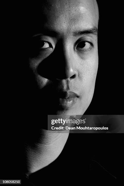 Marco Fu of Hong Kong poses for a photo after his victory against Mark Allen of Northern Ireland in the semi final of The Ladbrokesmobile Masters on...