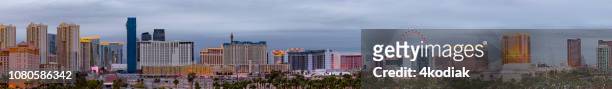 las vegas cityscape panorama on the strip in the evening hour - wynn las vegas stock pictures, royalty-free photos & images