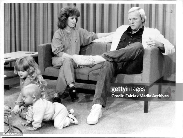 After his return to Australia yesterday, Greg Norman conducts a press interview watched by his wife Laura, while their children, Morgan Leigh and...