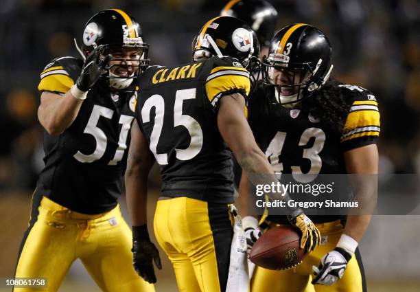 Safety Ryan Clark of the Pittsburgh Steelers celebrates with teammates James Farrior and Troy Polamalu after an interception of quarterback Joe...