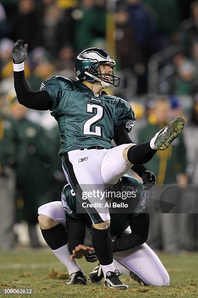 David Akers kicks as Sav Rocca of the Philadelphia Eagles holds against the Green Bay Packers during the 2011 NFC wild card playoff game at Lincoln...