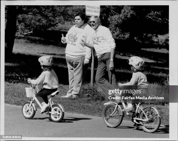 Sun &amp; Variety Club Bike a then at Centennial PK.Ricky May &amp; Barry Crocker ham it up with some youngsters. August 31, 1986. .