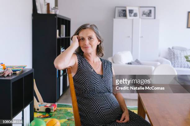 Portrait of relaxed mature pregnant at home