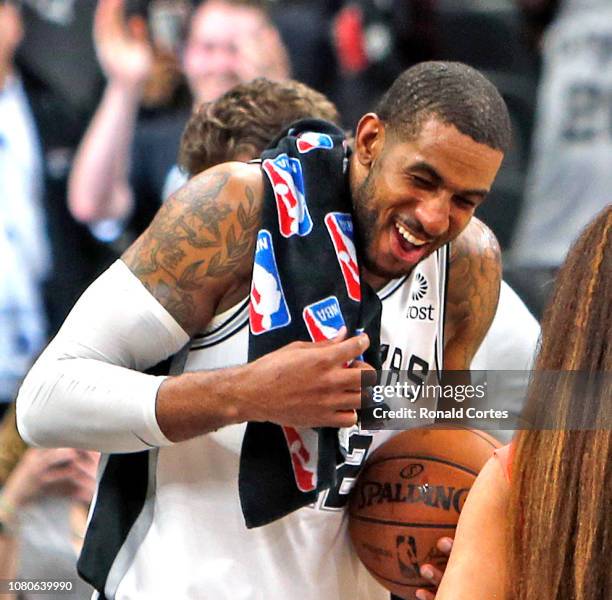 LaMarcus Aldridge of the San Antonio Spurs receives a little bath at the end of the second overtime against the Oklahoma City Thunder at AT&T Center...