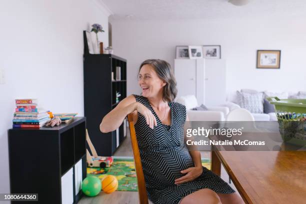 Portrait of relaxed mature pregnant at home