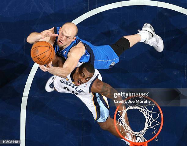 Darrell Arthur of the Memphis Grizzlies rebounds against Brian Cardinal of the Dallas Mavericks on January 15, 2011 at FedExForum in Memphis,...