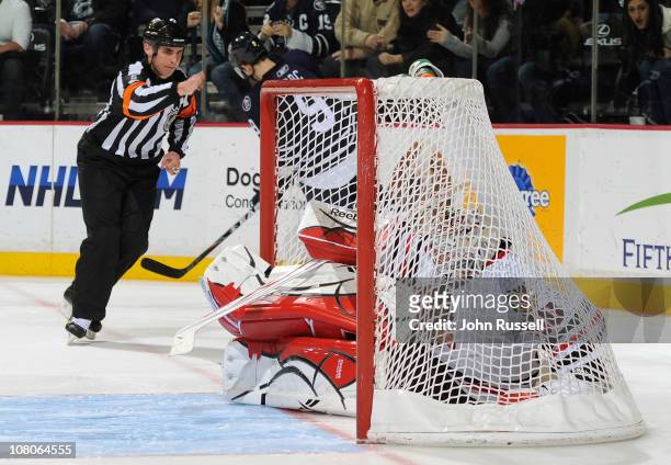 Marcel Goc of the Nashville Predators scores as goalie Corey Crawford of the Chicago Blackhawks goes in the net with the puck during a shootout in an...