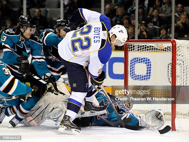 Goalie Antti Niemi the San Jose Sharks gets help from teammates Dan Boyle and Douglas Murray stopping the shot of Brad Boyes of the St. Louis Blues...