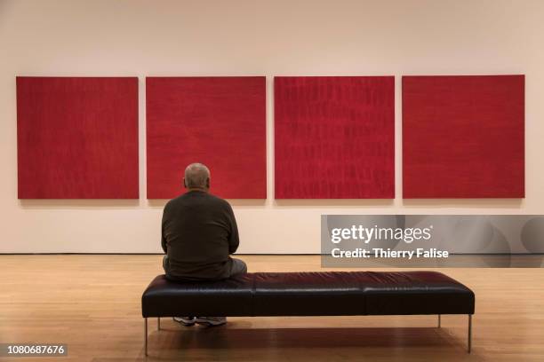 Man sits in front Rouge nos 3 6,2 a 1997 painting from Canadian artist Françoise Sullivan displayed at the Montreal Musée d'Art Contemporain , the...