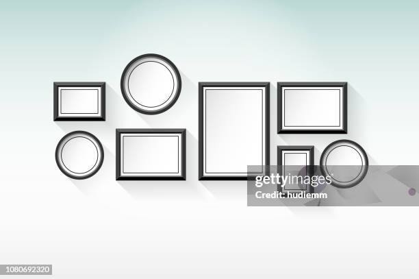 vector blank picture frame set on the wall background - photo frames wall stock illustrations
