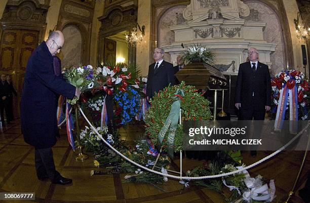 French Ambassador in Czech Republic Pierre Levy places flowers next to the coffin containing the remains of former Czech senator and former Czech...
