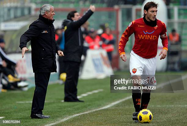 Roma's Francesco Totti runs with the ball while his coach Luciano Spalletti gestures during the Italian serie A football match Cesena vs AS Roma at...