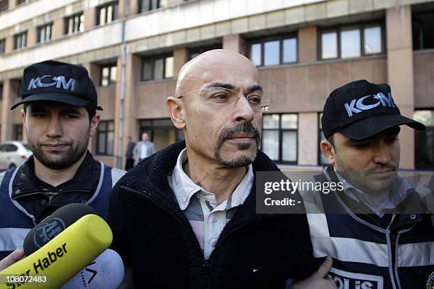 Turkish police escort doctor Yusuf Sonmez to a local court in Istanbul on January. 12, 2011. Sonmez was apprehended on January 12 in a raid on a...