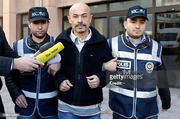 Turkish police escort doctor Yusuf Sonmez to a local court in Istanbul on January. 12, 2011. Sonmez was apprehended on January 12 in a raid on a...
