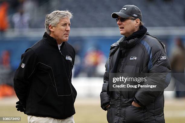 Head coach Pete Carroll of the Seattle Seahawks talks with Seahawks team owner Paul Allen before the 2011 NFC divisional playoff game against the...