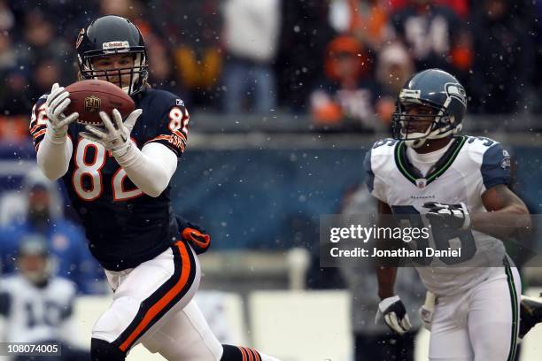 Tight end Greg Olsen of the Chicago Bears catches a 58-yard touchdown in the first quarter in front of Lawyer Milloy of the Seattle Seahawks in the...