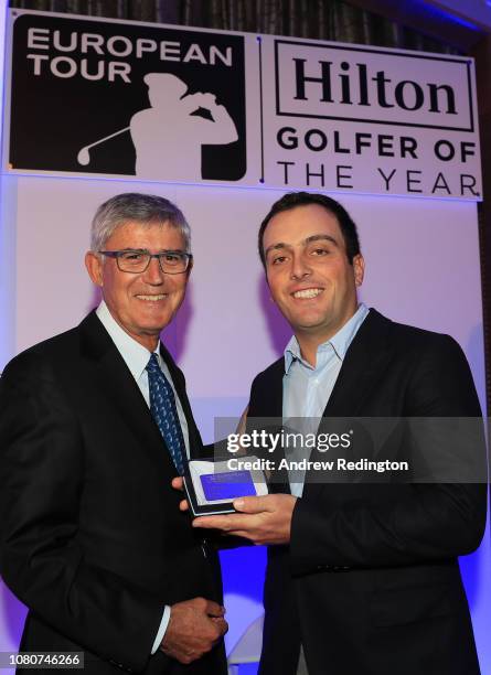 Francesco Molinari of Italy poses with the membership card as David Williams, Chairman of the European Tour, presents him with honorary life...