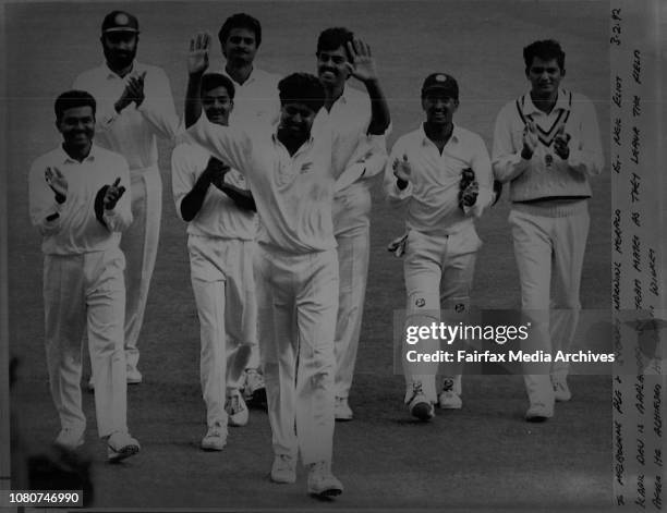 Kapil Dev is applauded by team mates as they leave the held after he achieved his 400th Wicket.Indian fast bowler Kapil Dev is applauded after...