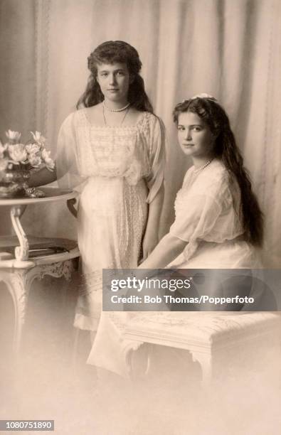 Vintage postcard featuring a photograph of two of the daughters of The Czar and Czarina of Russia: Grand Duchess Anastasia and Grand Duchess Marie,...