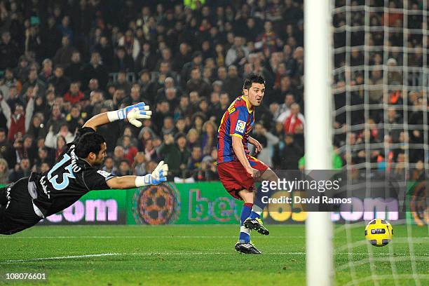 Sergio Asenjo of Malaga is unable to stop David Villa of FC Barcelona scoring his team's fourth goa during the La Liga match between FC Barcelona and...