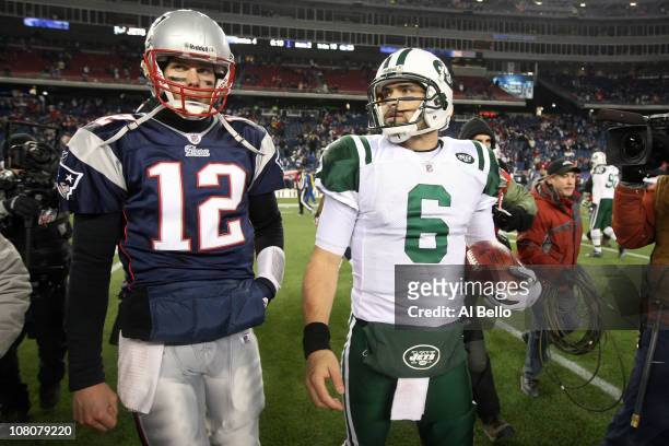 Tom Brady of the New England Patriots and Mark Sanchez of the New York Jets walk off the field after the Jets defeated the Patriots 28 to 21 their...