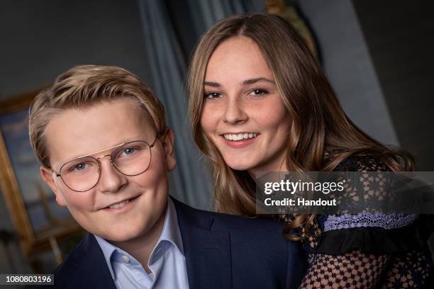 In this handout photo provided by the Royal Court, Prince Sverre Magnus poses with his sister Princess Ingrid Alexandra, for an official photograph...