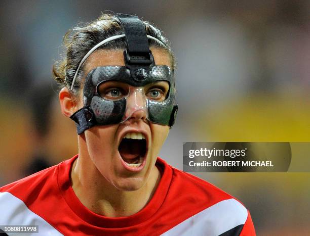 Canada´s striker Christine Sinclair who wears a mask shouts during the Canada vs Nigeria Group A match of the FIFA women's football World Cup on July...