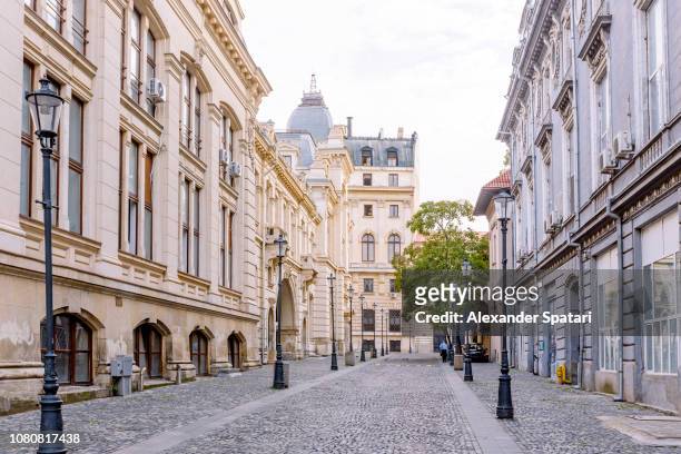 street in historical old town in bucharest, romania - bucharest stock pictures, royalty-free photos & images