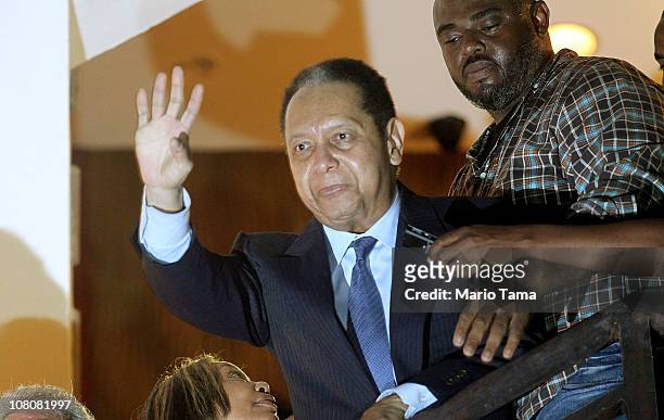 Jean-Claude Duvalier, the former Haitian leader known as 'Baby Doc', waves to supporters from a balcony of the Hotel Karibe on January 16, 2011 in...