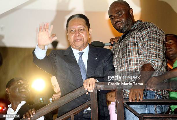 Jean-Claude Duvalier, the former Haitian leader known as 'Baby Doc', waves to supporters from a balcony of the Hotel Karibe on January 16, 2011 in...