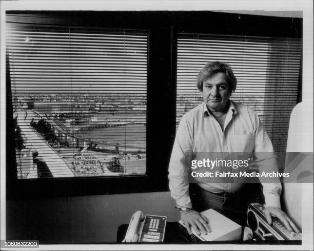 Ald Jack Mundey in his office in Town Hall Towers which overlooks the Darling Harbour Redevelopment &amp; the Proposed Monorail.Protester: Jack...
